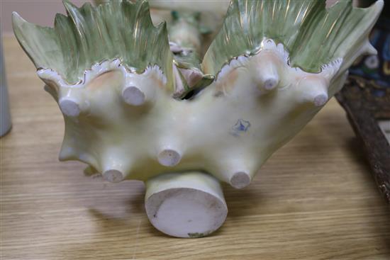 A bisque figurative shell shape centrepiece height 42.5cm